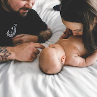 Couple enjoying their new baby girl