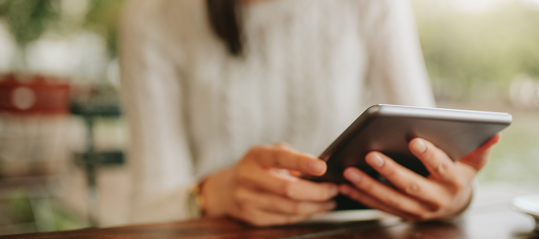woman holding a tablet in her hands